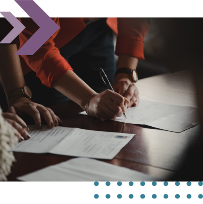 Solicitor and client signing a bridging-loan agreement in a law firm office