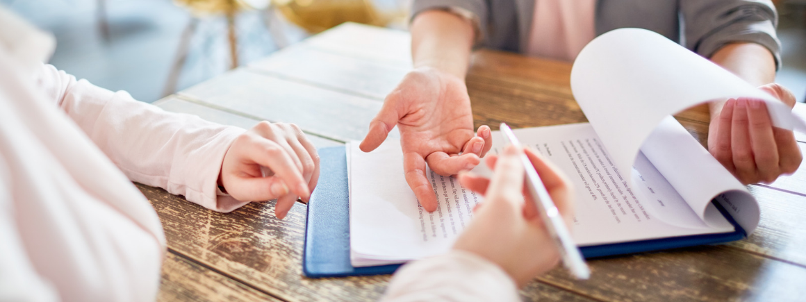 Business owner reviewing terms and conditions with a commercial law solicitor